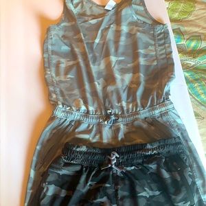 A gray and white cameo romper& black cameo shorts